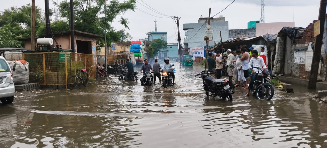 Siwal Khas submerged in the first monsoon rain; development works exposed.
