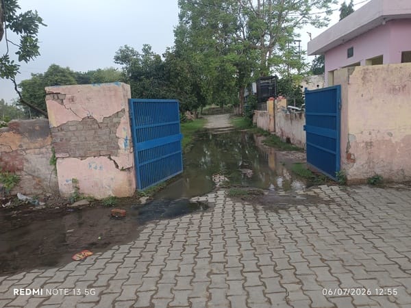 Sewage water from outside is flowing in through the main gate, causing inconvenience to employees and others entering and leaving.
