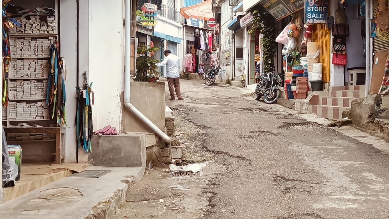 Potholes on the road turn the commute to the hospital and school into a nightmare.