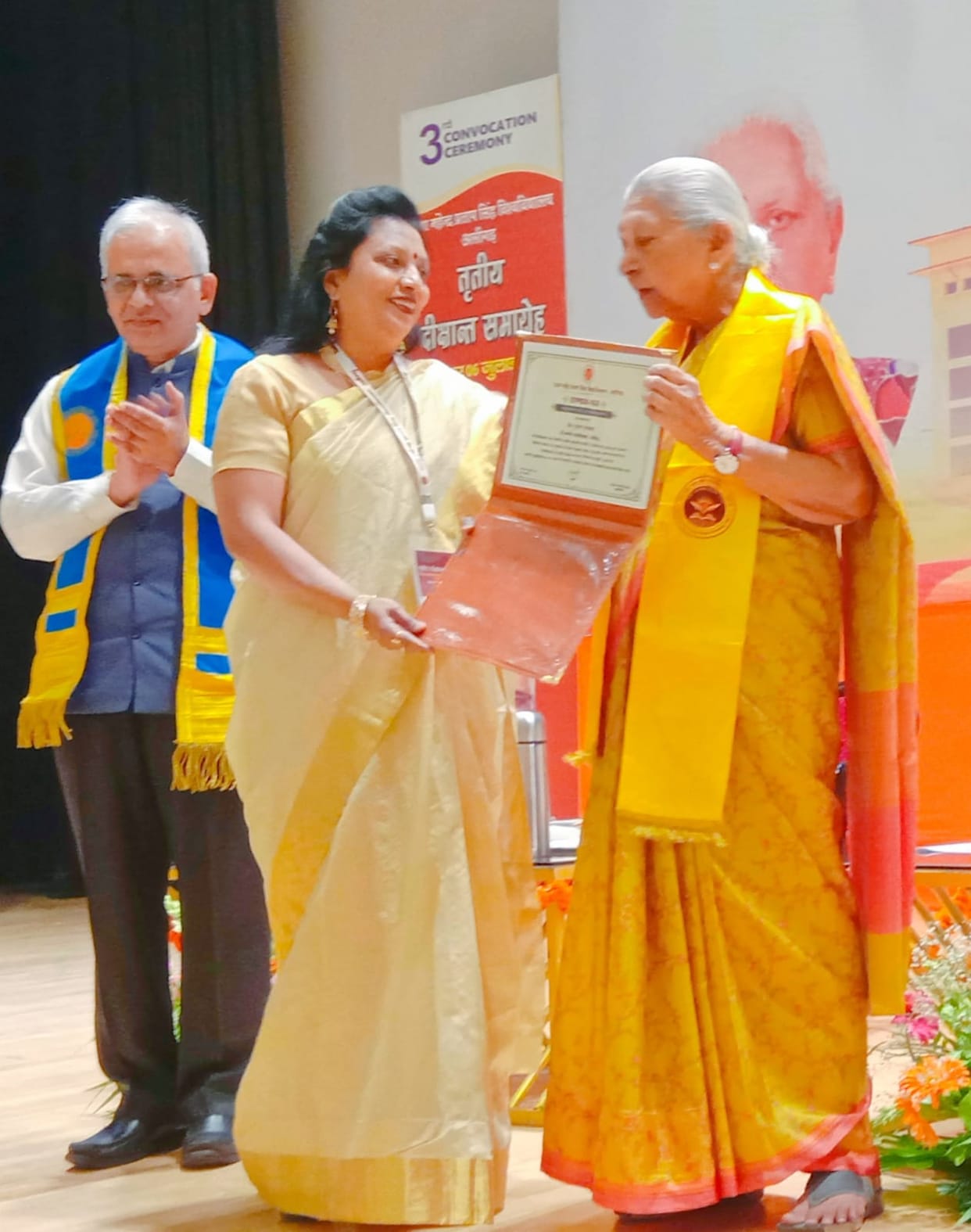 Governor confers 'Outstanding Teacher Award' upon the city's daughter.