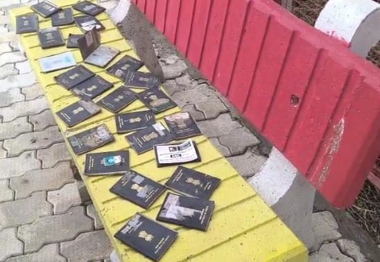 31 passports found in sack caught during fishing; two arrested.