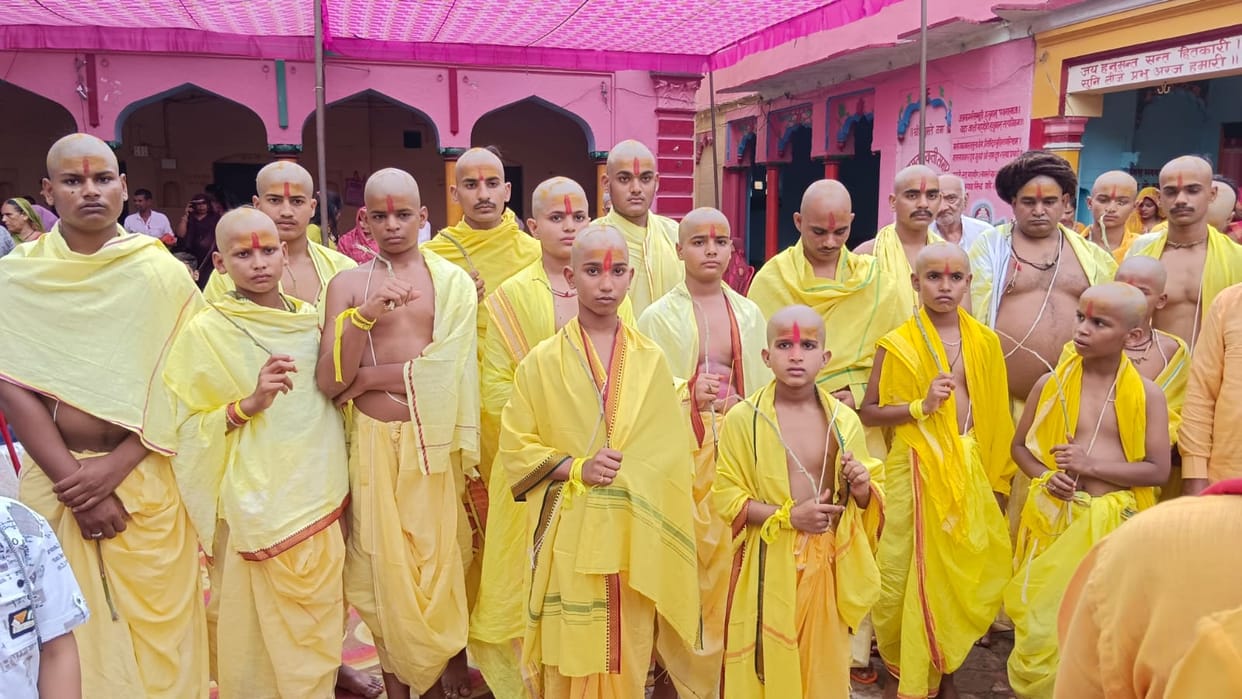 Upanayana ceremony of 21 young initiates celebrated with great fanfare.