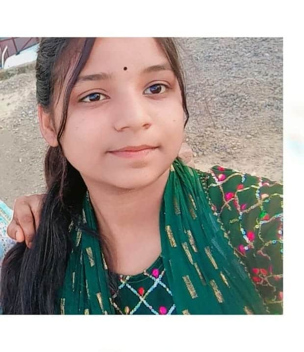 Young woman takes her own life by hanging herself while talking on the phone.