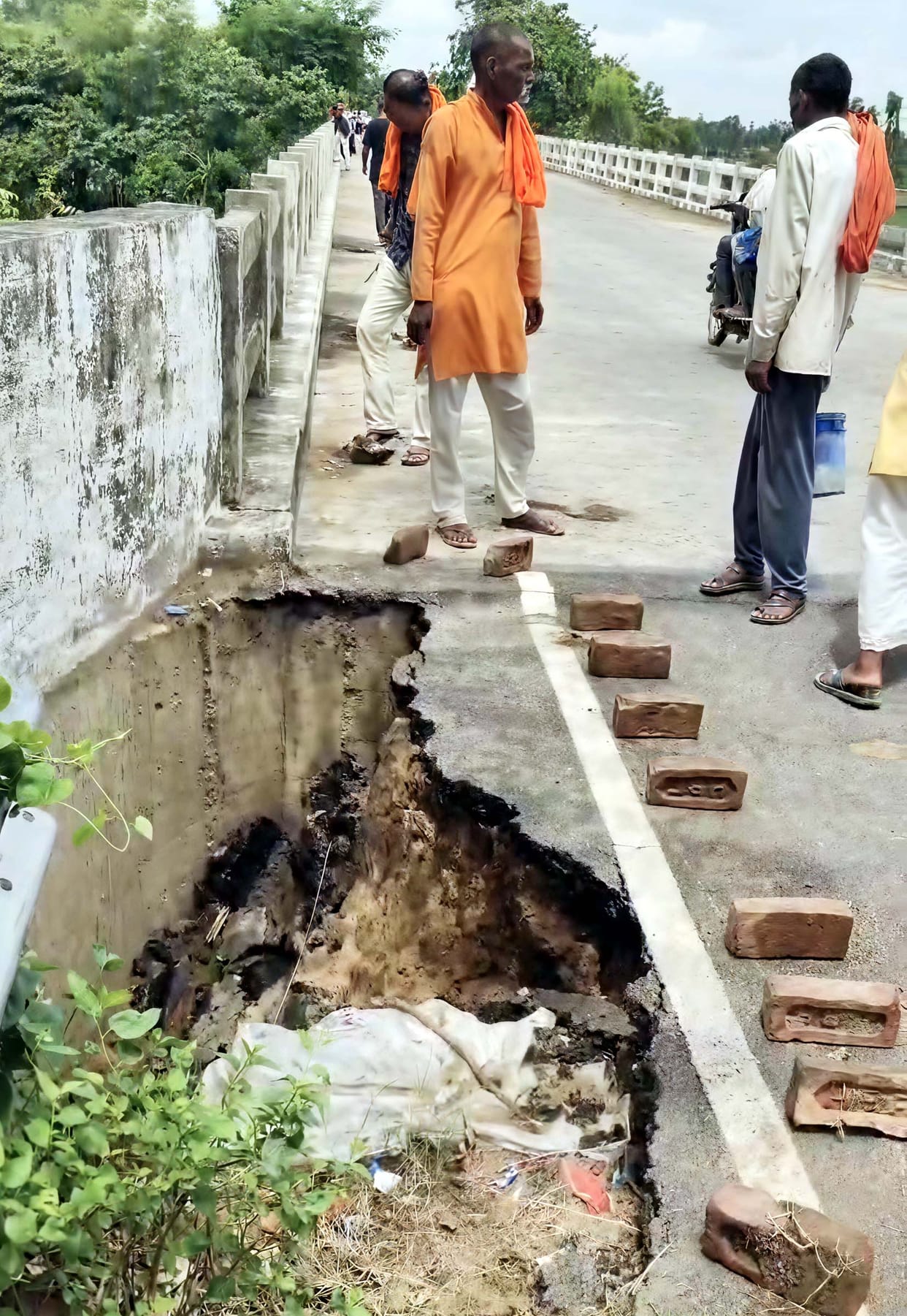 Section of approach road near Pannaghat Bridge caves in.