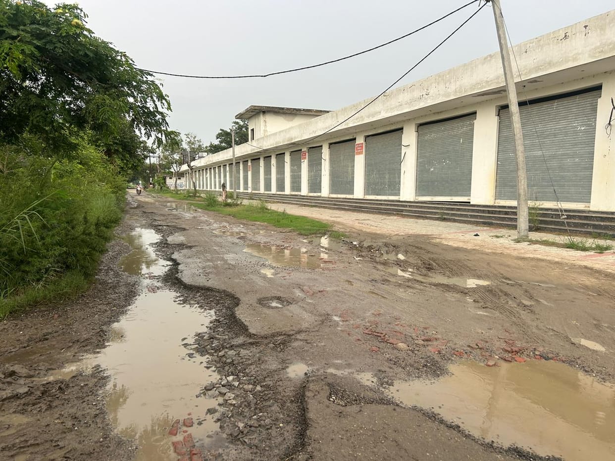 A bumpy ordeal before reaching the village: 1.5 km approach road turns into a nightmare.