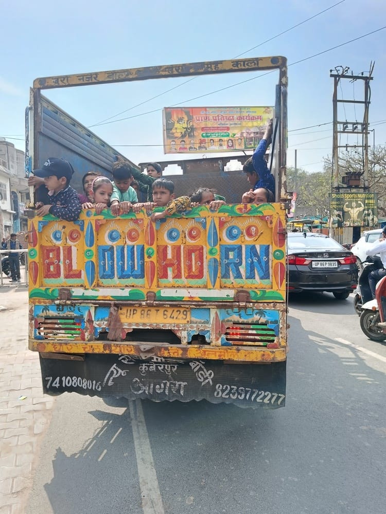 Rules flouted... passengers being ferried in goods vehicles.