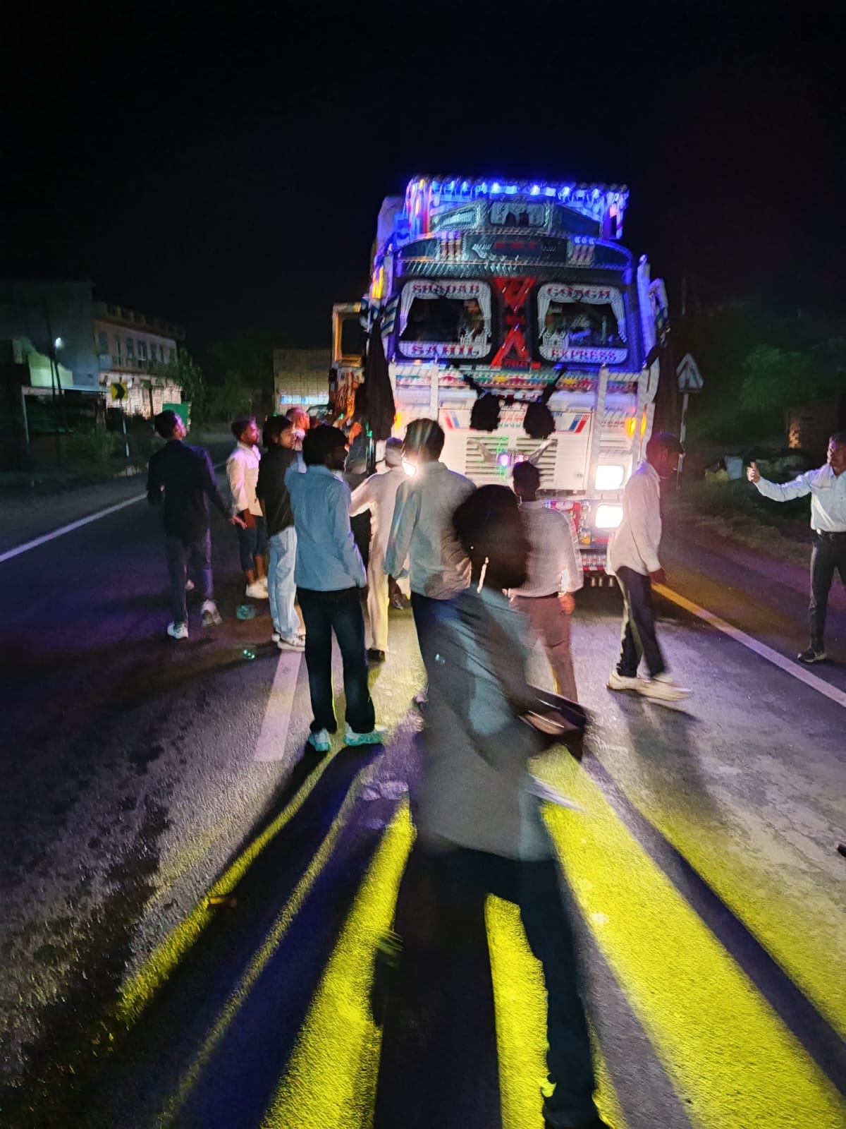 Wedding guests attacked a truck with bricks and stones and beat up the driver.
