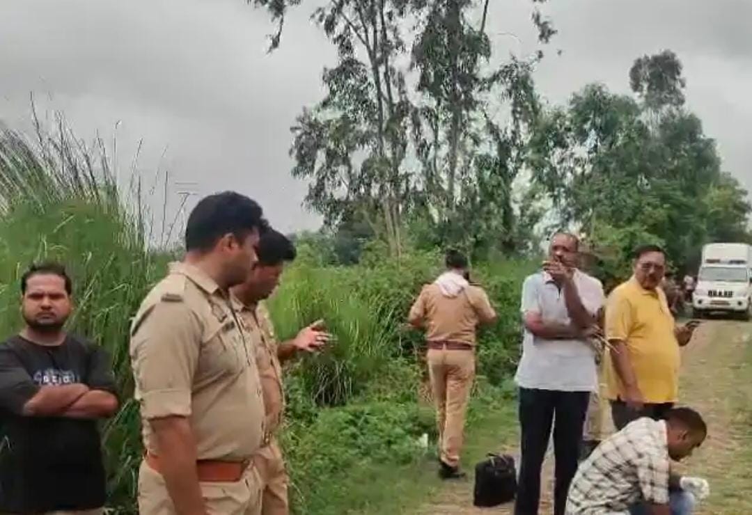 Woman murdered, body found in field; one in custody