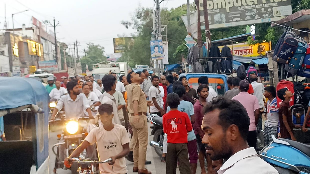 Youth climbs water tank; traffic jam at Subhash Chowk.