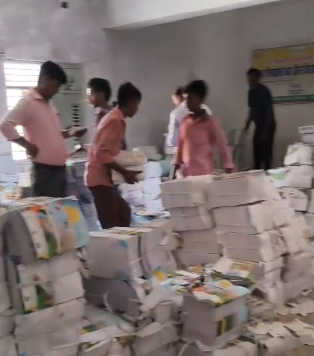 Video of children being made to carry books goes viral.