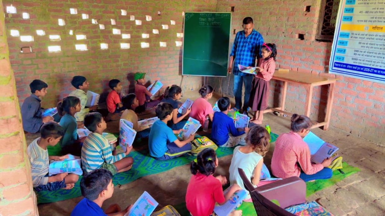 School washed away by floods still lacks a building after eight years; currently operating from the former village head's house.