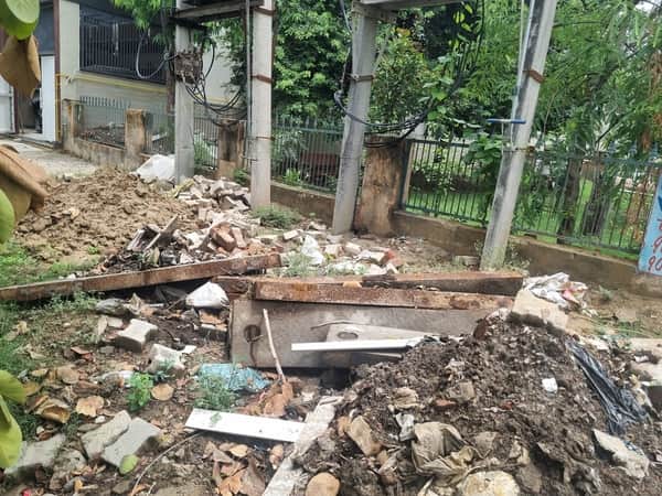 Silt left behind after drain cleaning; Municipal Council waiting for an accident to happen.