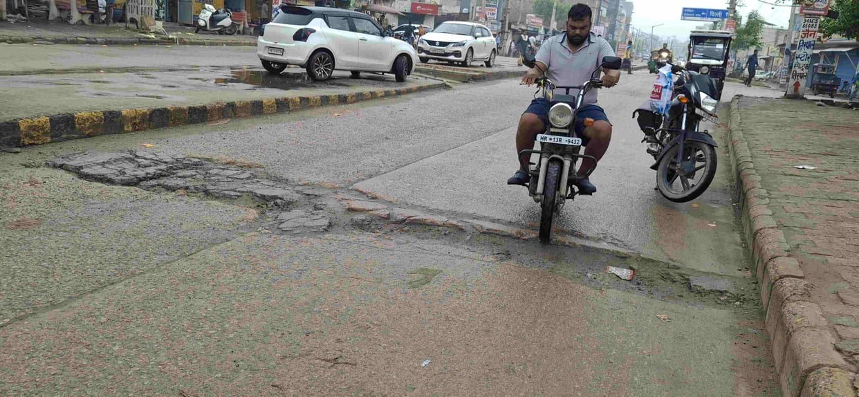 Rain reopens road wounds; potholes emerge everywhere.