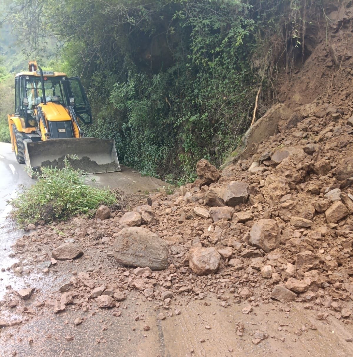 Rocks kept falling from the hillside at Galu; traffic disrupted.
