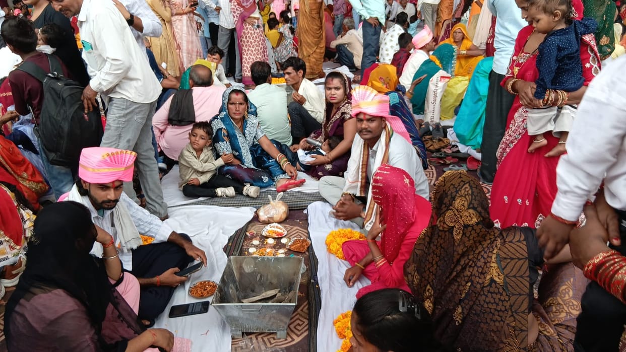Rain disrupts mass wedding arrangements; beneficiaries and their families left drenched.