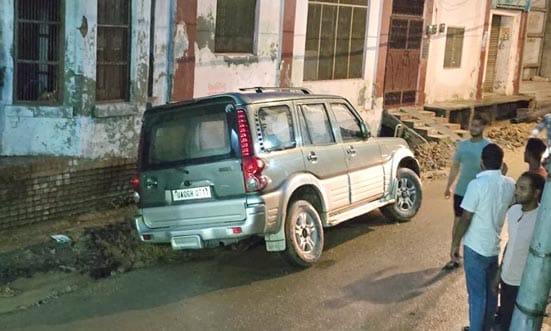 Another car trapped in a pit due to a cave-in