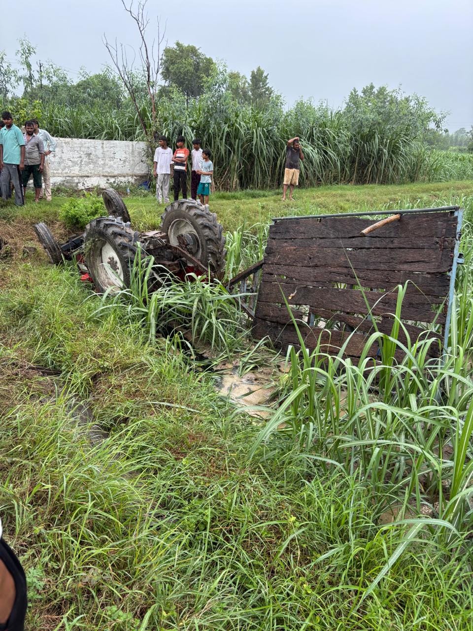 Former head and his wife died when their tractor-buggy overturned.