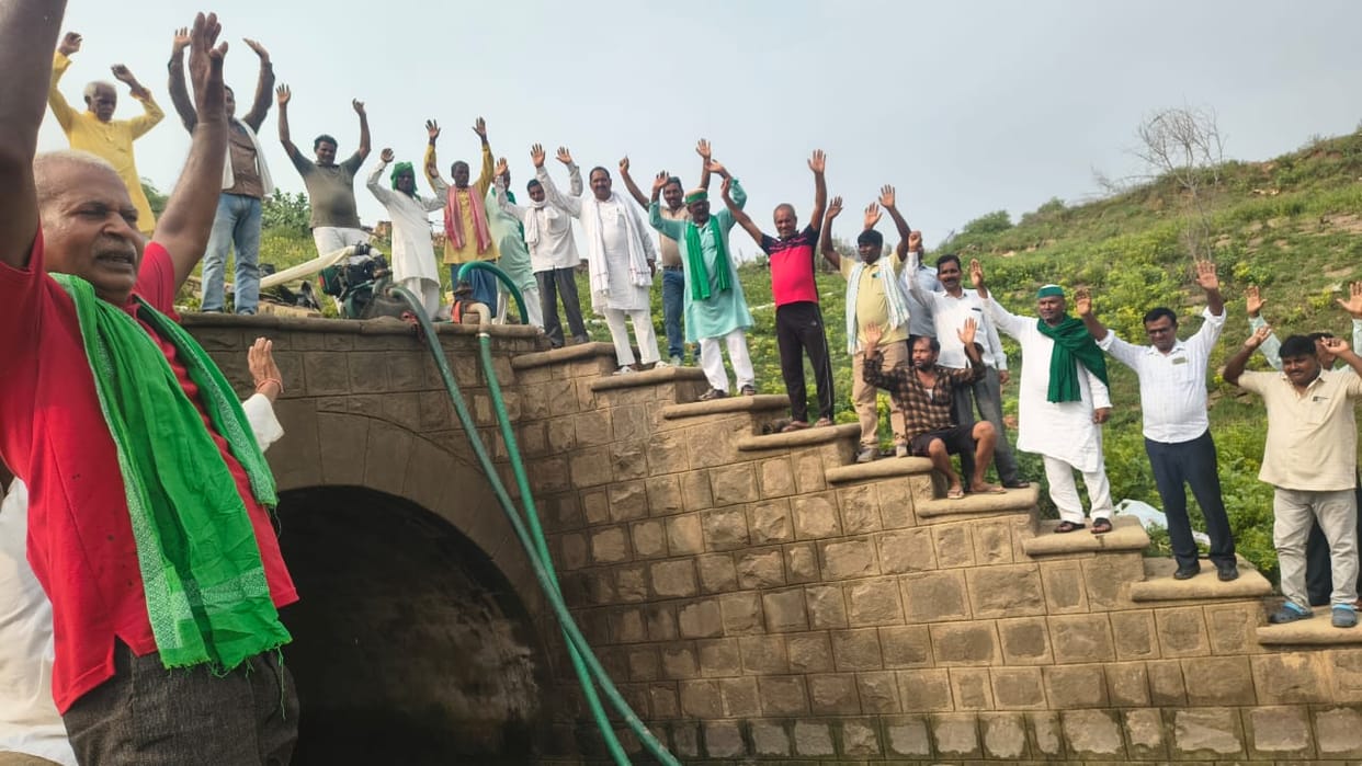 Farmers arrived to halt the construction of a wall on the main canal.