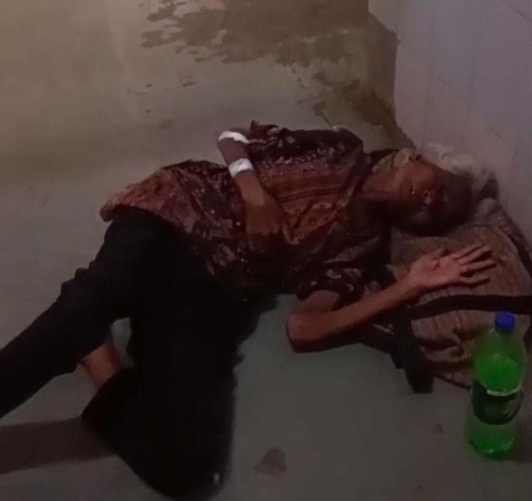 Elderly destitute woman discharged from Lokbandhu Hospital after treatment; left writhing in pain in the veranda.