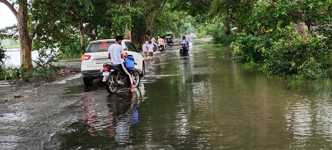 Commuting hazardous due to deep potholes at Bhimkund T-junction following rain.