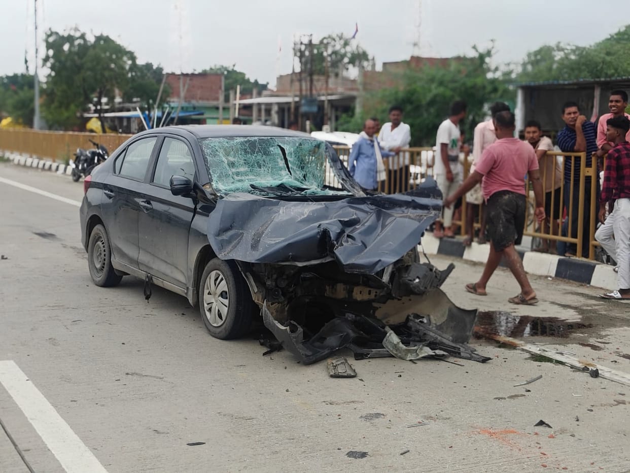 Collision between tractor-trolley and car; driver critically injured.