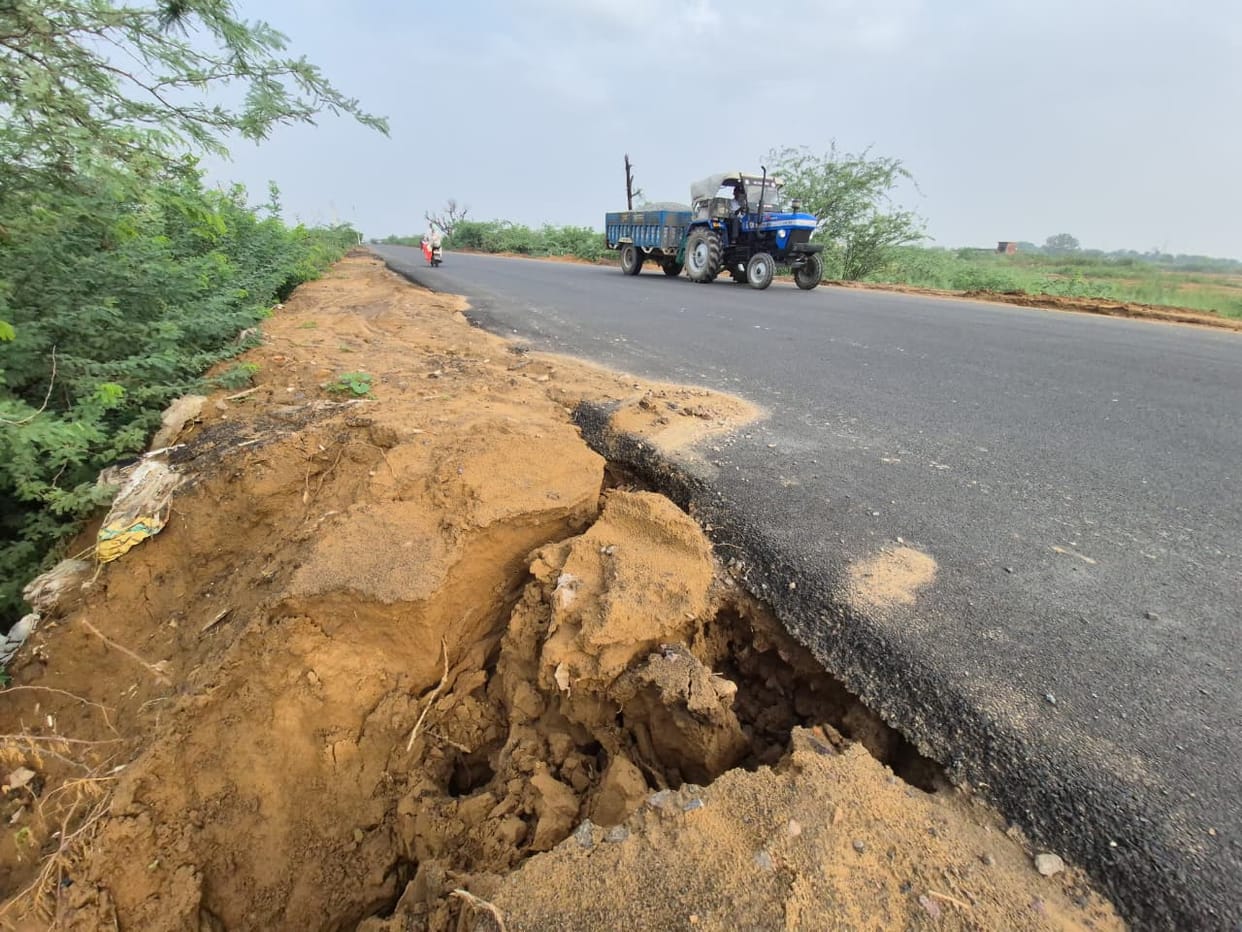 The soil slipped away... the road remained.