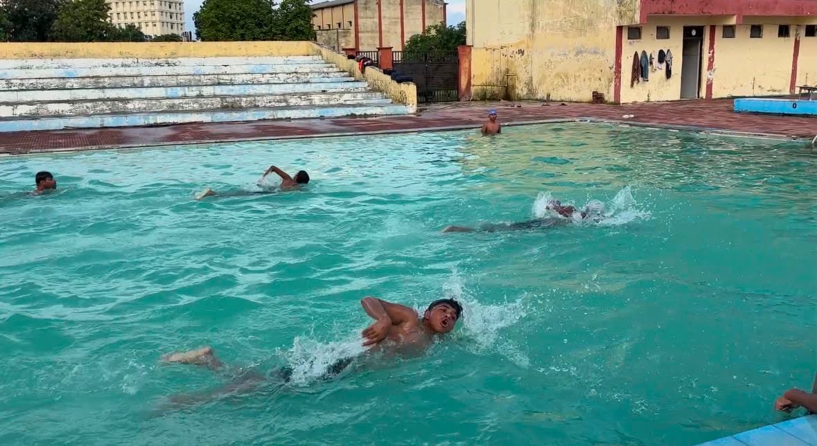 Swimmers preparing for the state-level swimming competition.