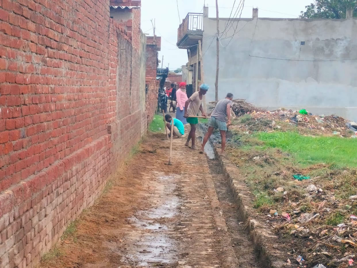 Not the staff, but the villagers themselves picked up shovels and cleaned the drain.