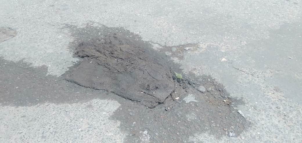 Potholes not filled... failure had to be covered up with sacks.