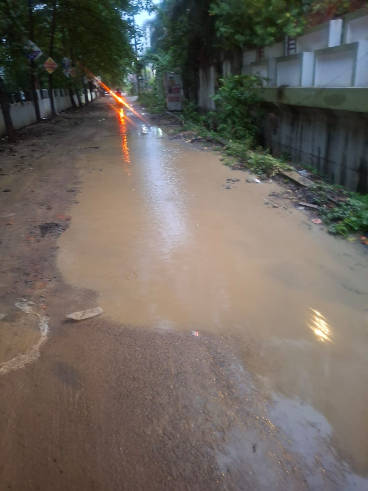 If the broken road is not repaired, residents of Sargam Apartments will now hold a 'Mud Festival'.
