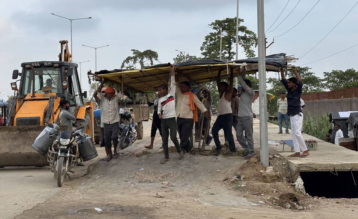 Bulldozer action on Ashok Marg; over 50 shops removed.