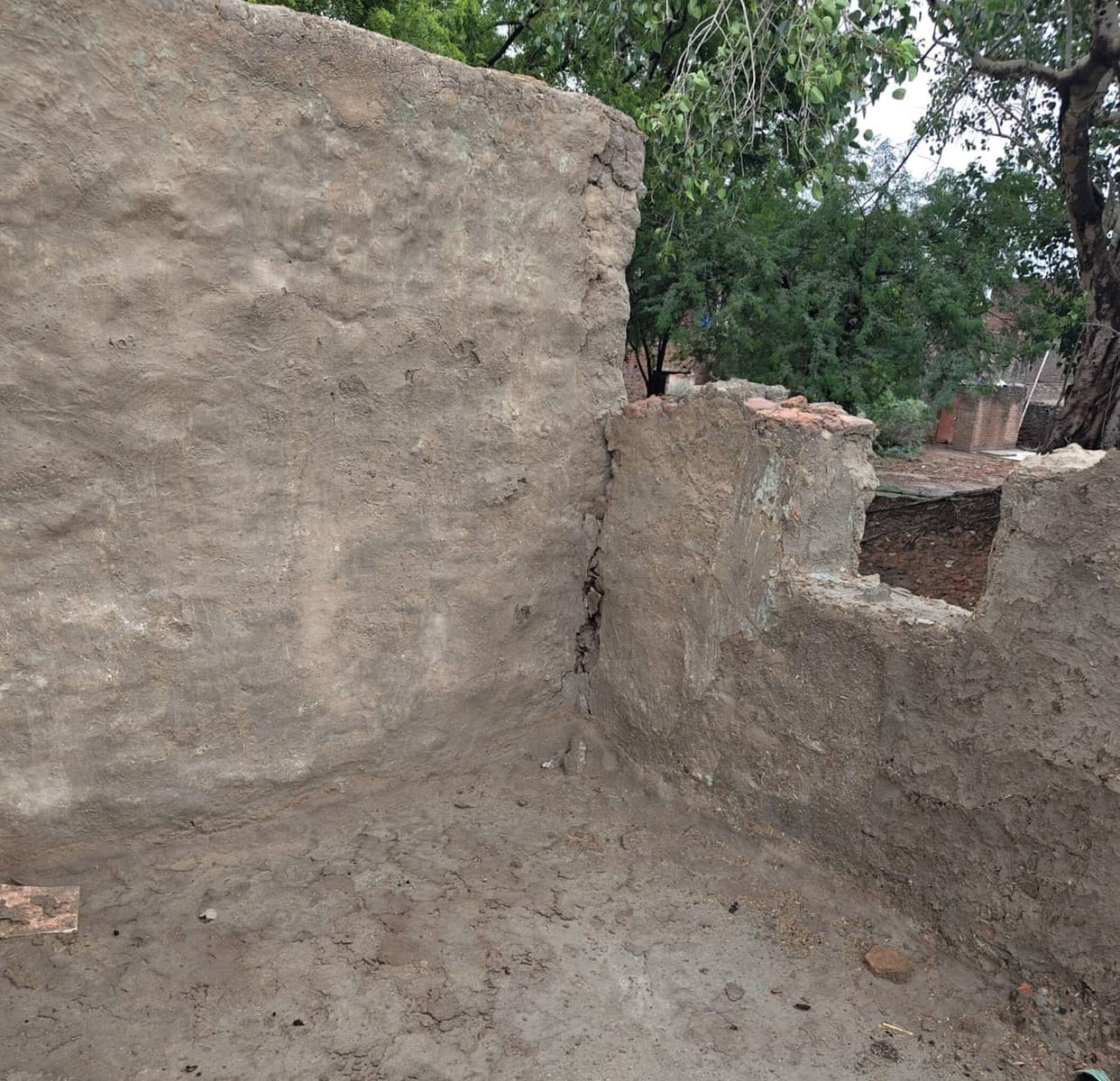 Mud house collapses in the rain; household belongings destroyed after being buried under the debris.