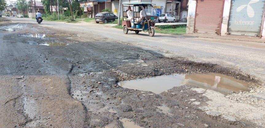 Potholes at every step, roads broken in the rain