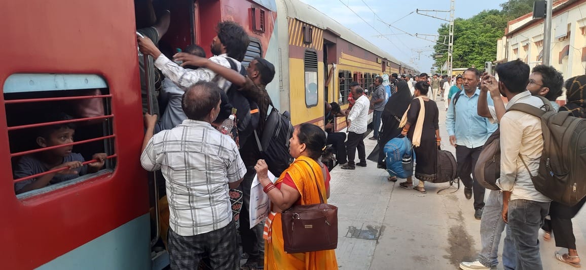 Trains ran on the tracks; passengers thronged the station.