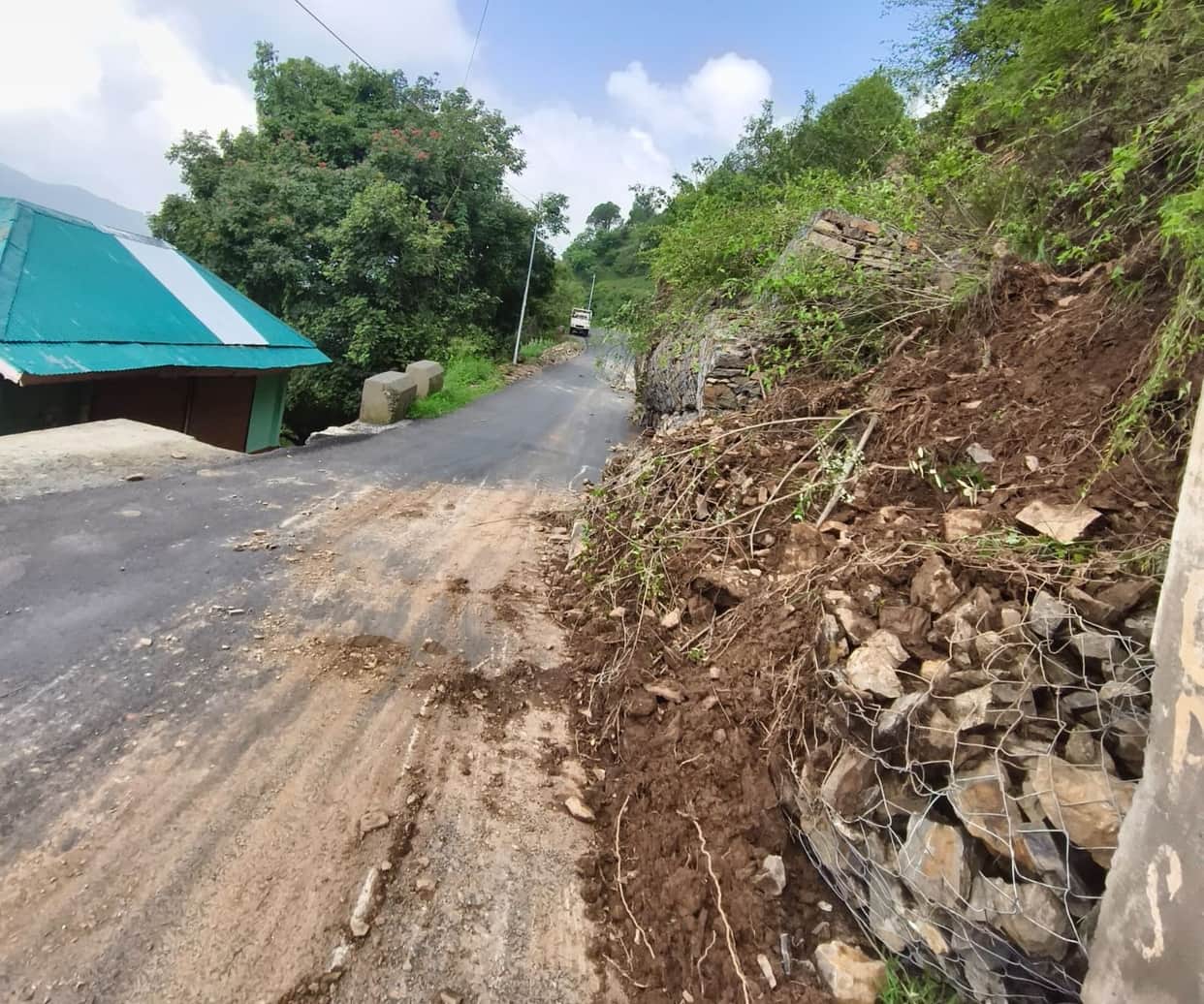 Retaining wall built six months ago on the verge of collapse; three-storey house at risk.