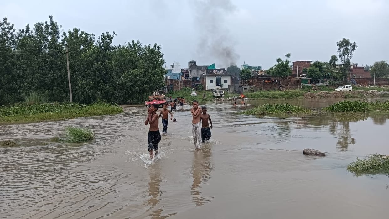 The water level of the Dhamola River has risen, cutting off the village's connection with the public road.