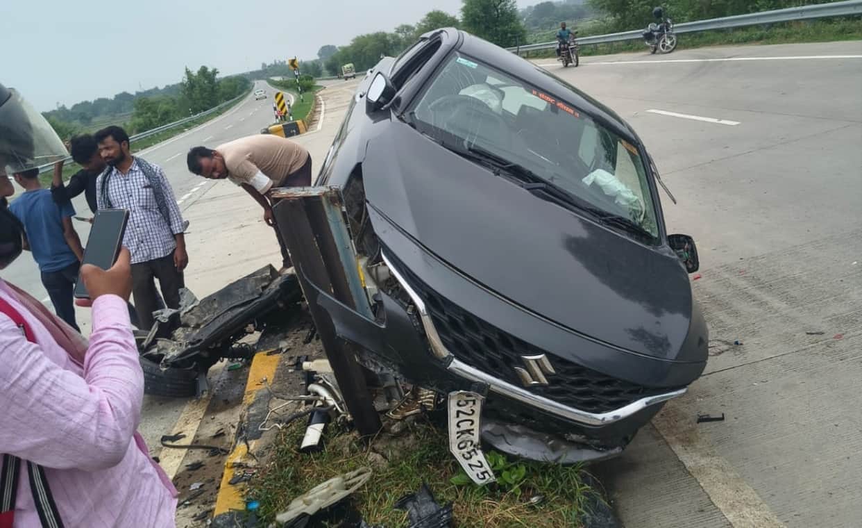 Car hits divider; two youths injured.