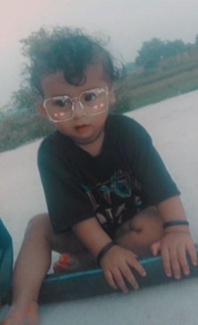 An innocent child playing outside his house was crushed by a tractor and died.