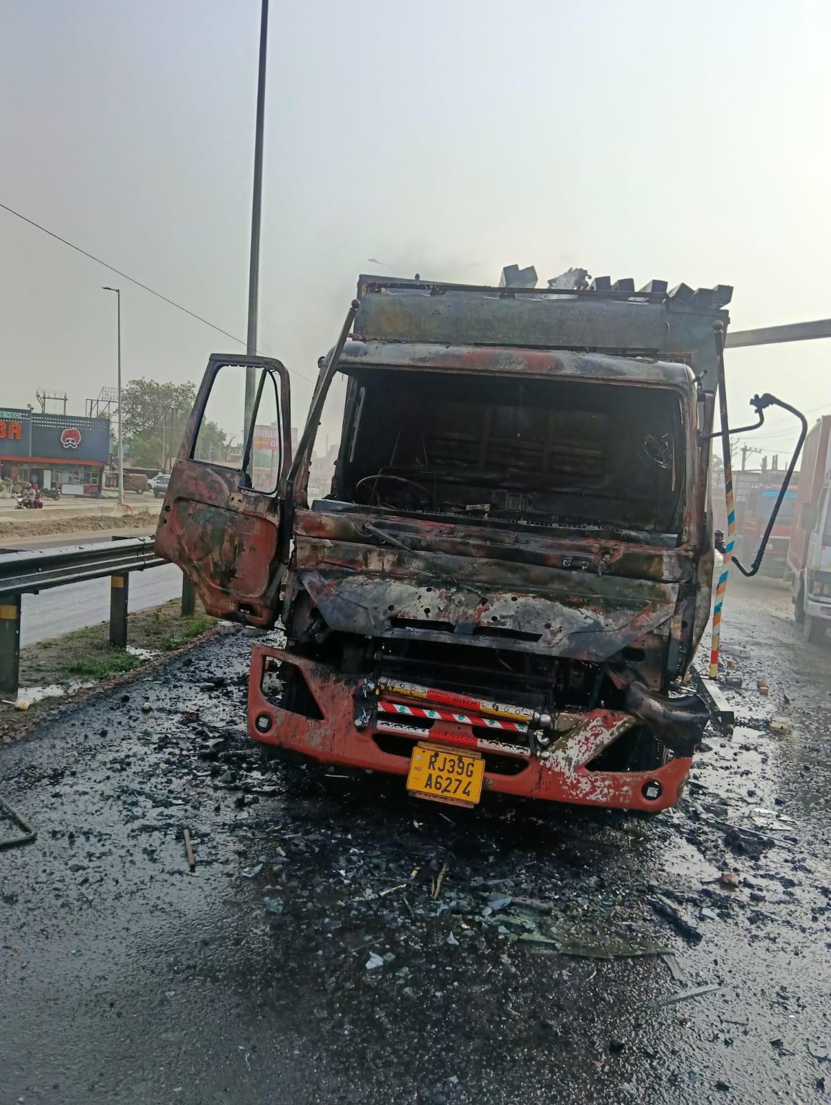 Fire breaks out in grocery-laden Canter truck after colliding with a dumper on the highway.