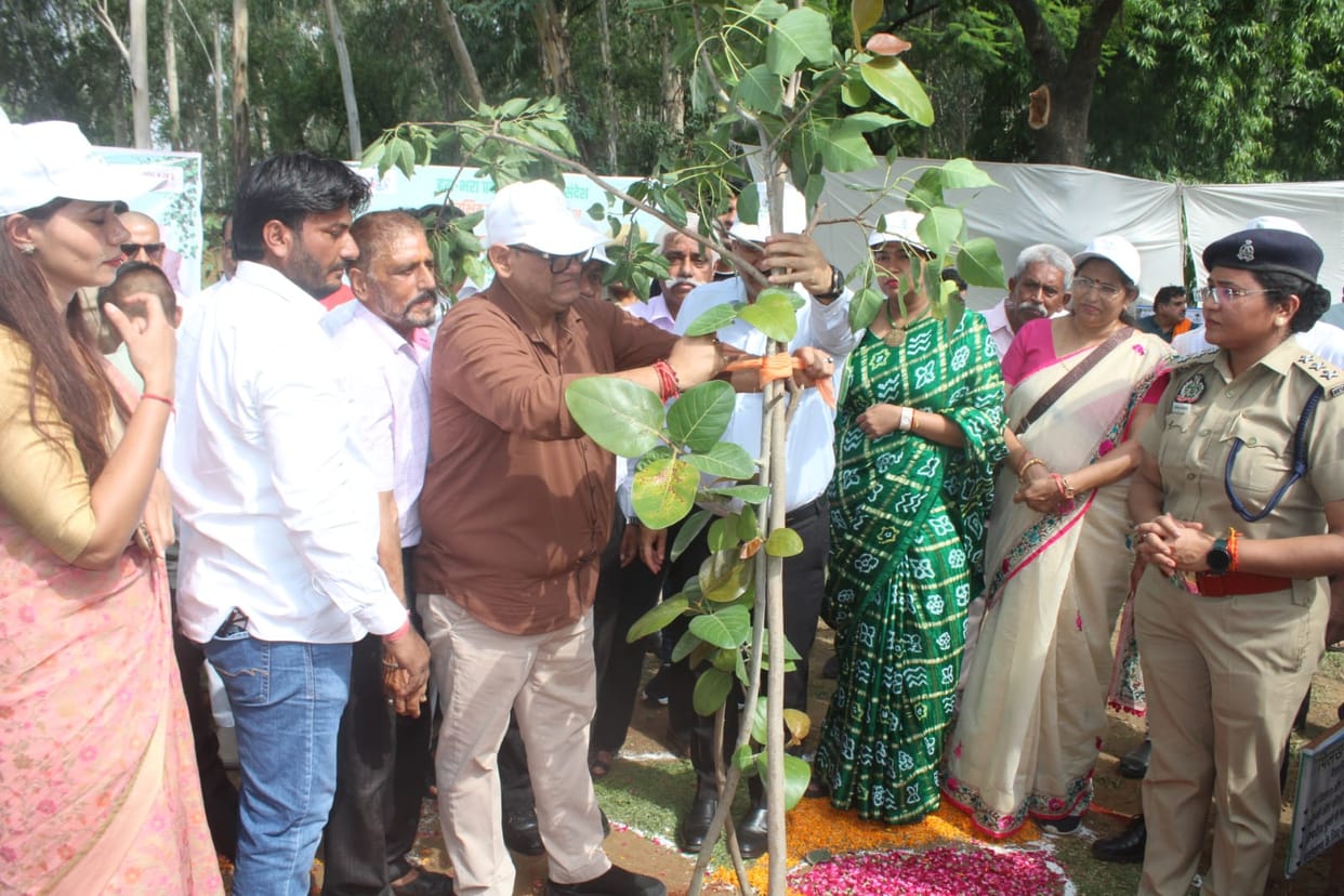 The grand tree-planting drive was inaugurated with the planting of a 'Harishankari' sapling.