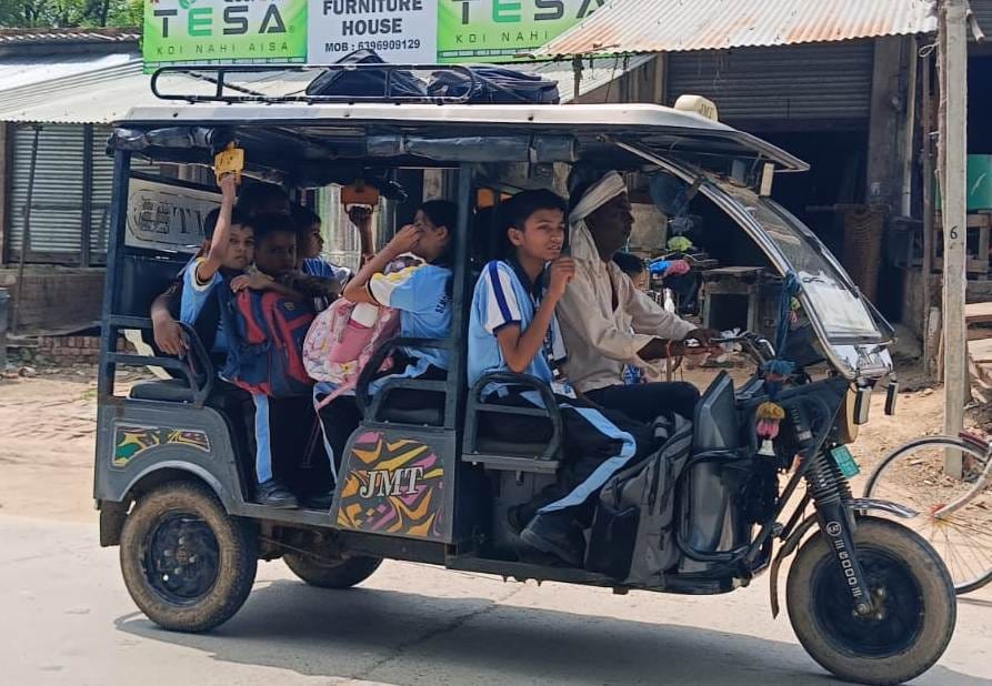 School children being transported in vehicles beyond capacity.