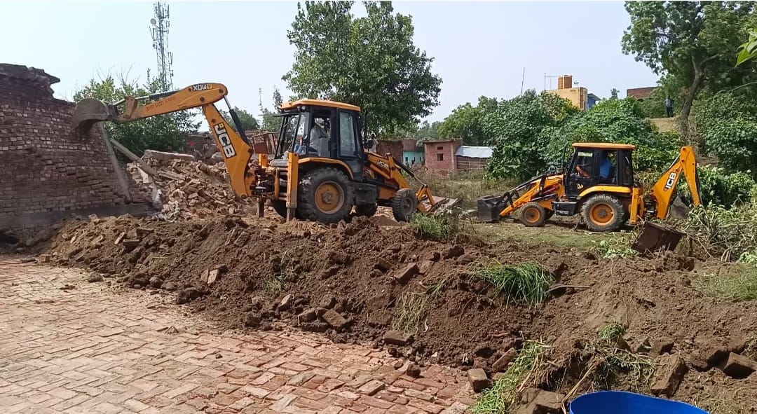Encroachment removed from pond land following court order.