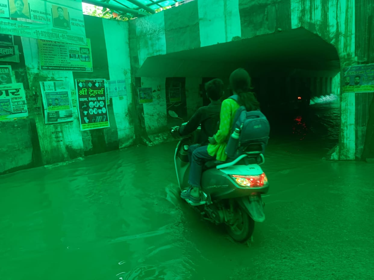 Rain exacerbates difficulties; railway underpass flooded.