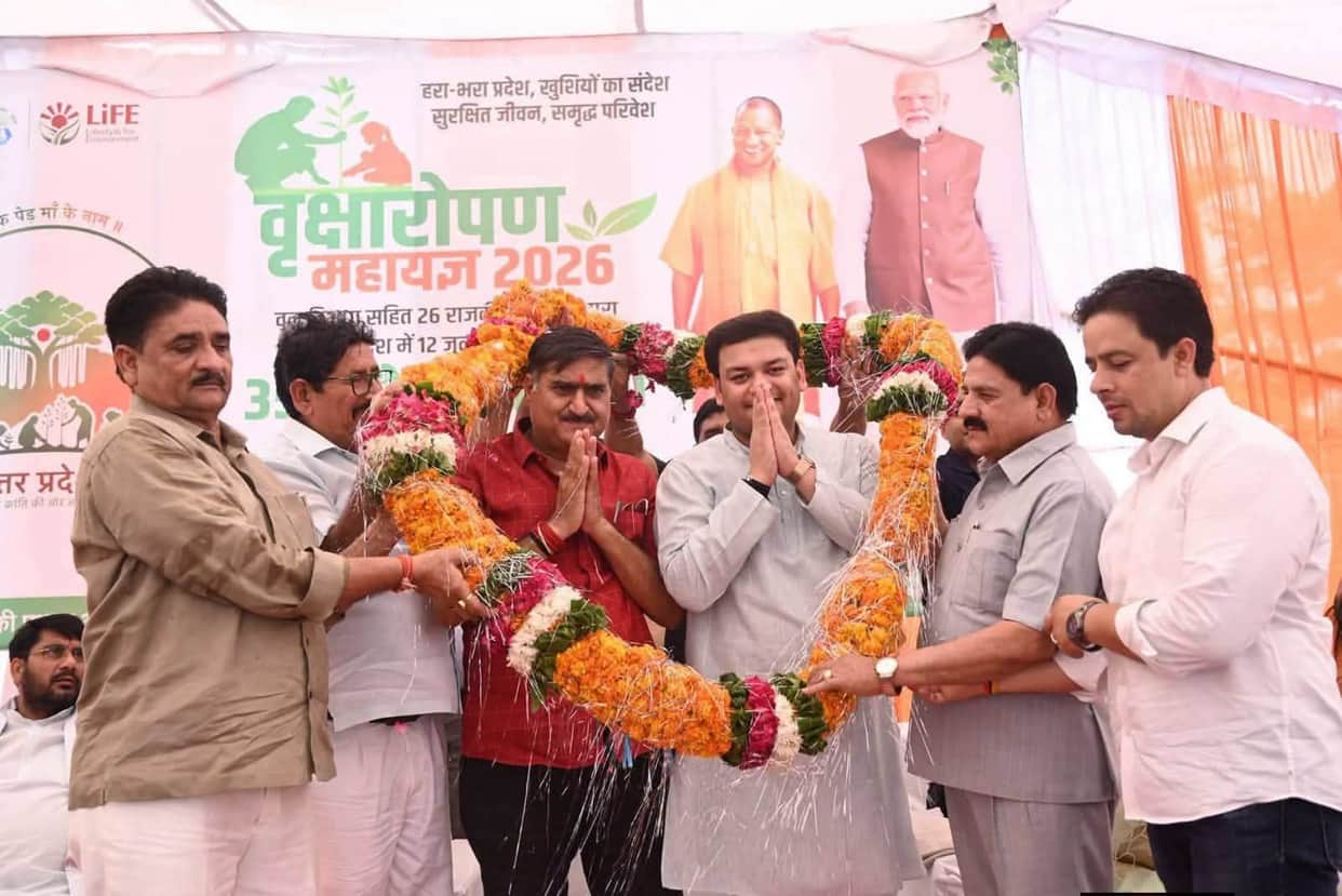 History-sheeter Mujahid seen on the dais with the minister, MP, and MLA at a tree plantation event