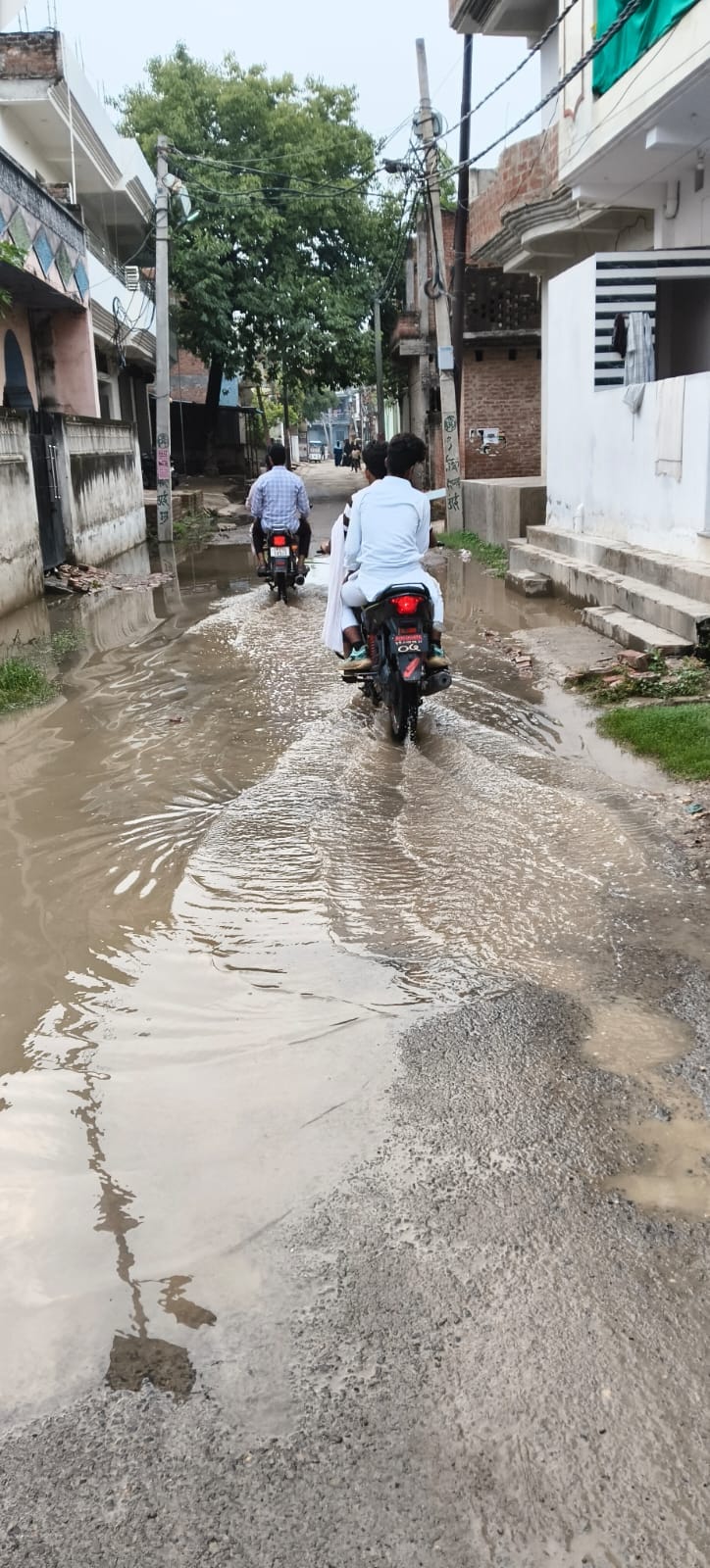 Main road closed due to overbridge construction; waterlogging on the alternative route
