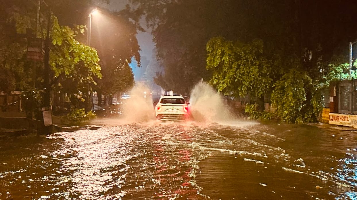 City in disarray due to heavy downpour; traffic disrupted by waterlogging.