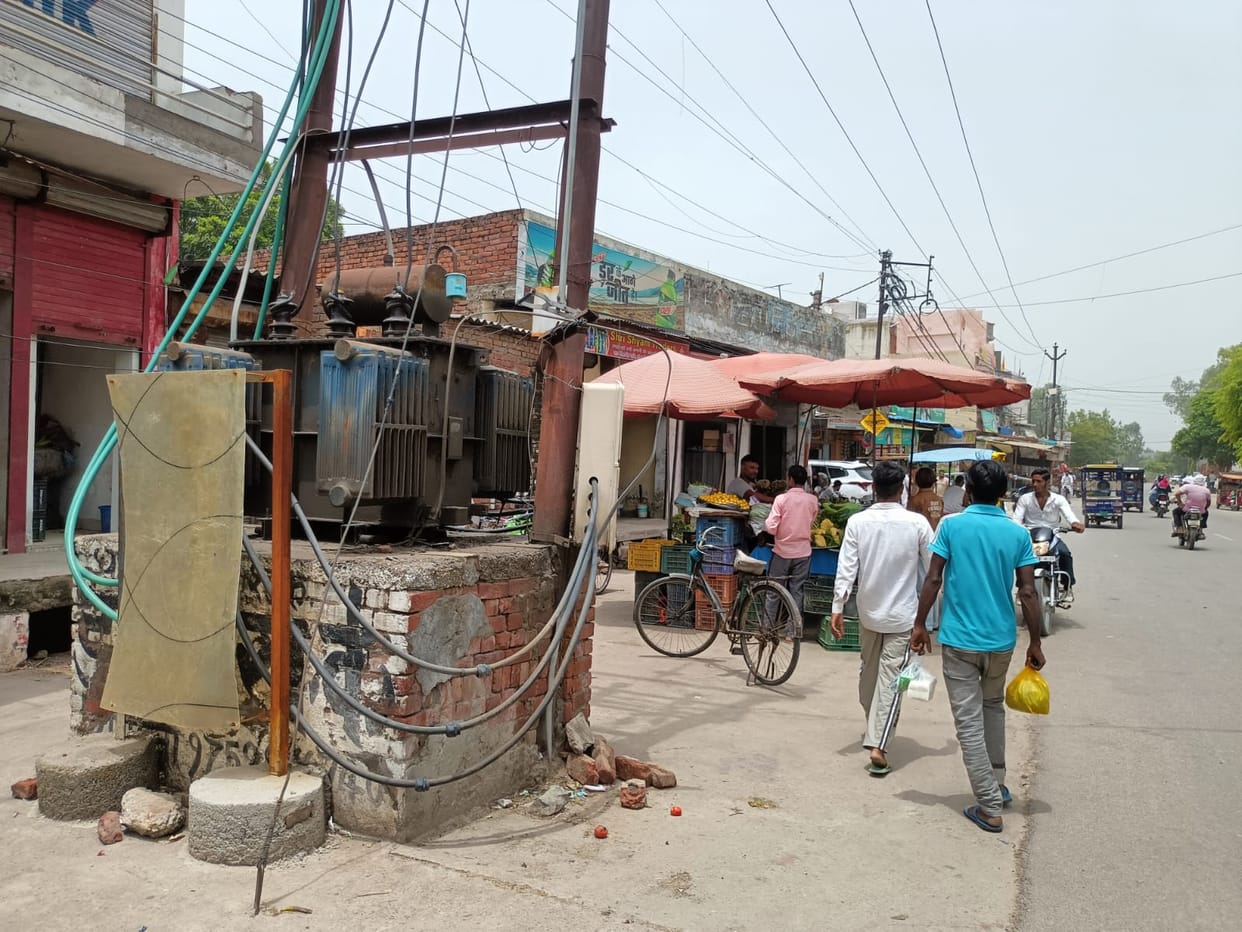 Transformers placed in the open by the roadside; constant risk of accidents.