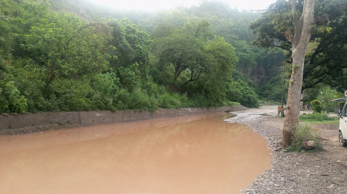 Roads turned into ponds and land caved in at places; people are risking their lives while traveling.