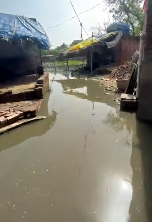 Rain-swollen streets turned into ponds; water flooded homes.