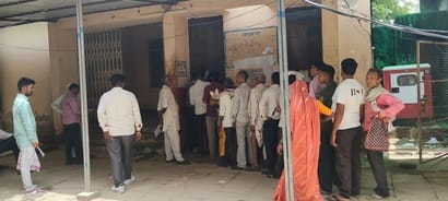 Distribution of land records stalled due to slow server; farmers stood in queues for hours.